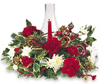 Christmas hurricane arrangement with red carnations, white mums and Christmas greens.